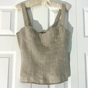 Reformation linen top in tan with elastic panel and zipper in back.